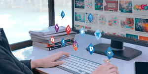 A person typing on a keyboard adorned with various social media icons, emphasizing digital communication.